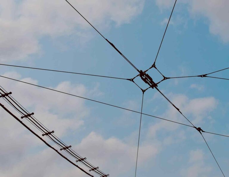 FEATURED_o-of-overhead-power-lines-against-blue-sky